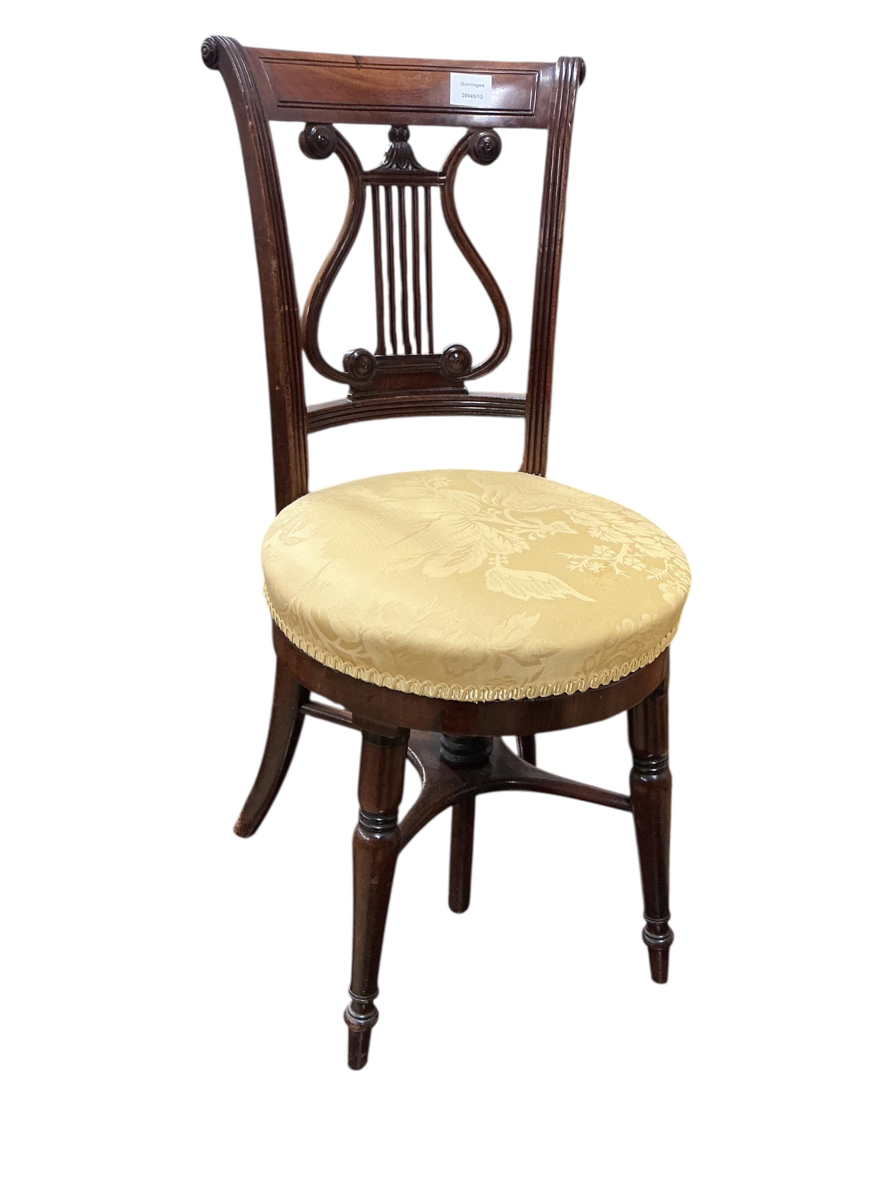 A Regency mahogany music chair with adjustable seat